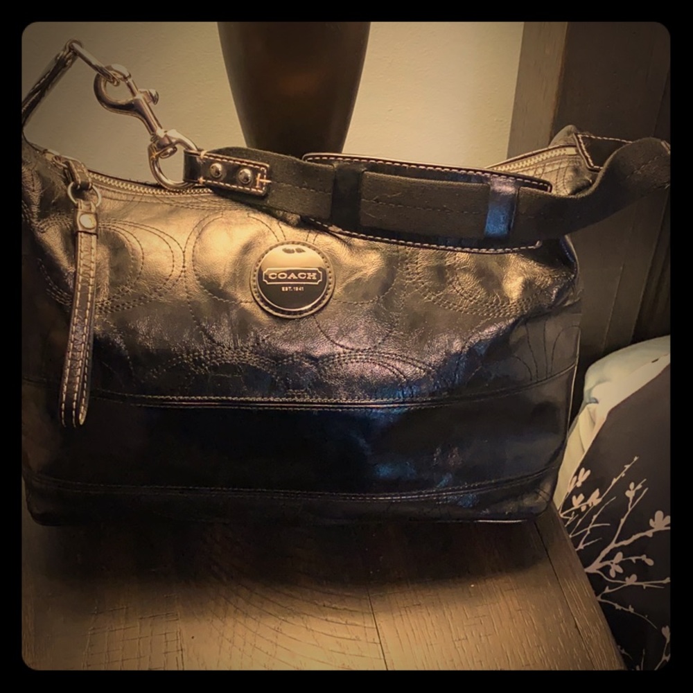 Black leather Coach purse blue lining